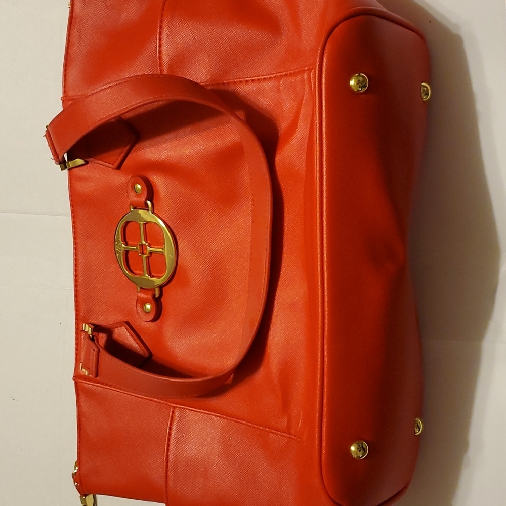 Iman designed tote bag, RedFauxLeather,pockets inside and out,goldtone hardware